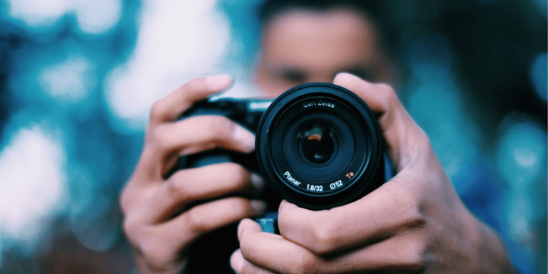 A man holding a camera.